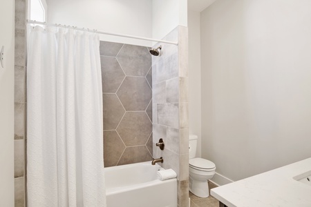 The private bath in bedroom #6 has a tub/shower combo