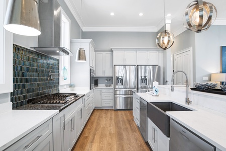 Spacious kitchen with island, double refrigerators and dishwashers