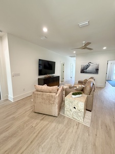 The 2nd floor living room offers a TV and mini kitchen