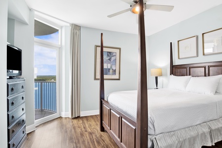 Guest bedroom 2 offers a Queen bed, TV, balcony access with Lagoon views and a private bathroom