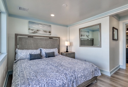 The 2nd master bedroom offers a King bed, TV, private bathroom and balcony access