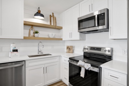 Fully equipped kitchen with stainless appliances