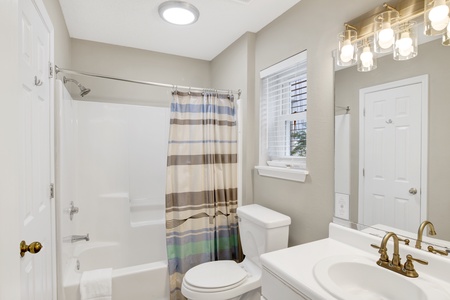 The attached bathroom features a tub/shower combo and is accessible from the hallway