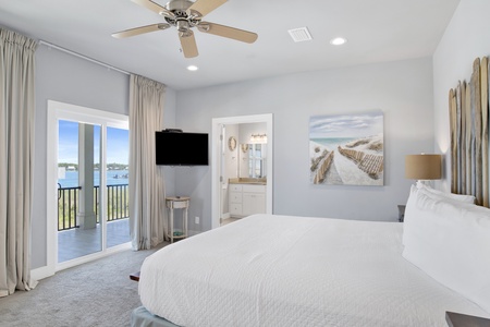 The primary bedroom offers a private bathroom, balcony access, TV and King bed, sleeps 2