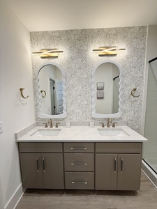 The private bathroom has dual vanities