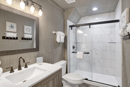 1st floor remodeled bathroom with a walk-in shower