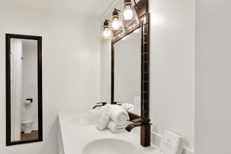 The hall bathroom has double vanities