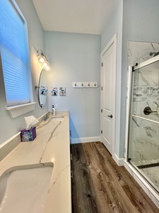 Attached Master Bath with double vanities and a walk-in shower