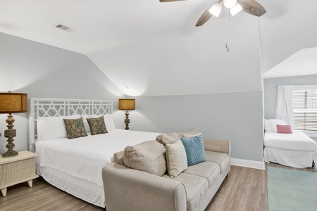 This guest bedroom offers a King bed and 2 Twin single beds