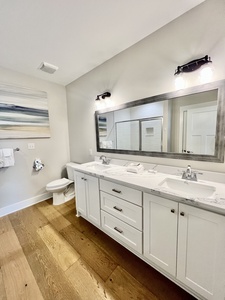 Private master bathroom with a double vanity