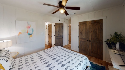 The master bedroom has a TV and a private bathroom