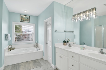 The private bathroom in Bedroom 3 has a double vanity and a garden tub