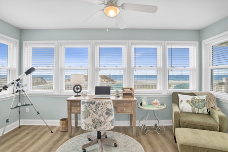 Work from your master bedroom with views of the beach in this cozy office space.
