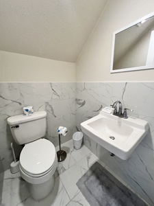 Half bathroom in the hallway