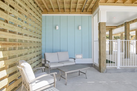 Shaded area under the home near the pool deck