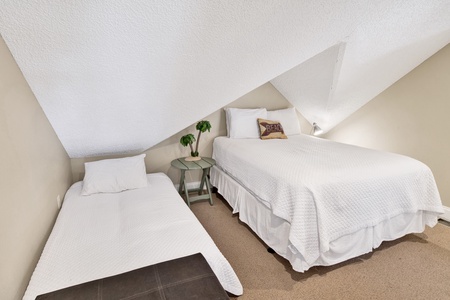 Bedroom 5 offers a private bathroom, TV and Queen and Twin bed, sleeps 3