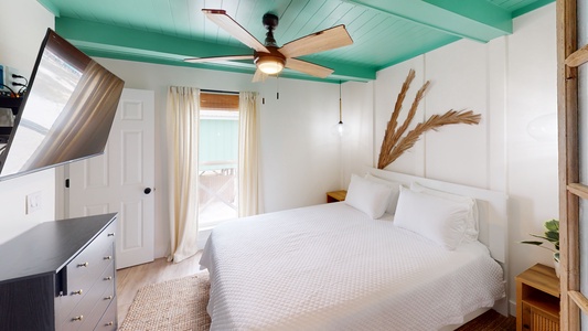 The Master bedroom features a queen bed, television and a private bathroom