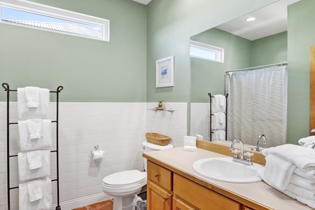 Main floor hall bath with a walk-in shower