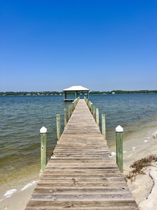 Private beach and boardwalk over the little lagoon