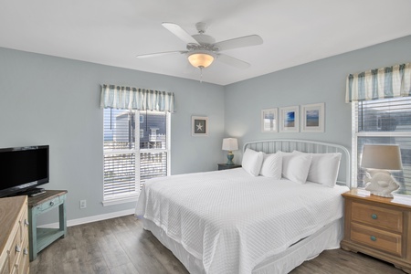 The master bedroom has a King bed, TV and private bath