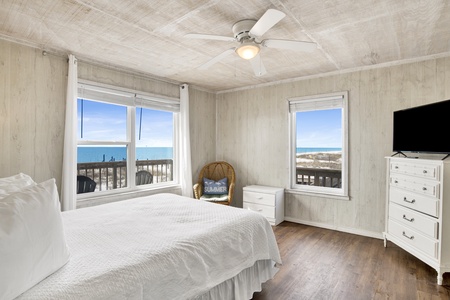 The master bedroom features a ceiling fan, TV and a private bathroom