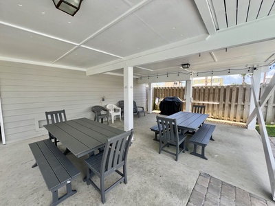 Propane grill and outdoor dining tables