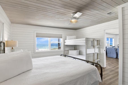 The primary bedroom sleeps 4 and showcases views of the Gulf