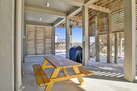 Carport with propane grill and picnic table