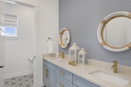 The private bathroom offers double vanities and a tub/shower combo