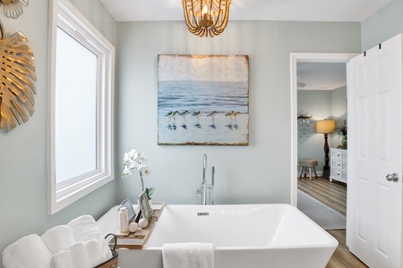 Take a bubble bath in this full size tub in the master bathroom