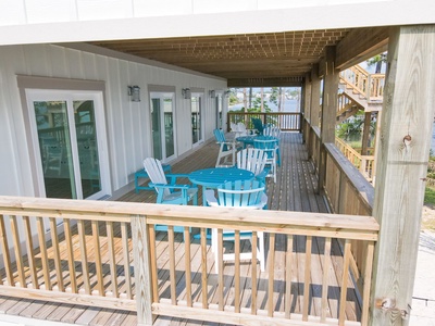 The second level deck provides several bistro tables and chairs with great views of the Bayou