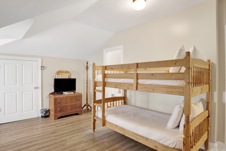 This guest bedroom sleeps 6 guests and shares the Jack and Jill bathroom