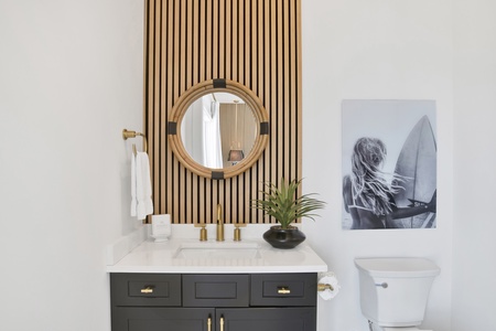 The private bathroom has a single vanity