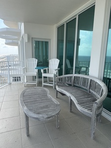 Spacious balcony with plenty of seating to take in beautiful Gulf views