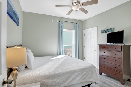 Located on the main level bedroom 2 features a king bed and TV