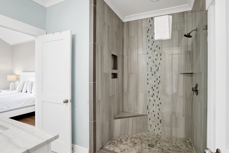 It features a walk-in, tile shower