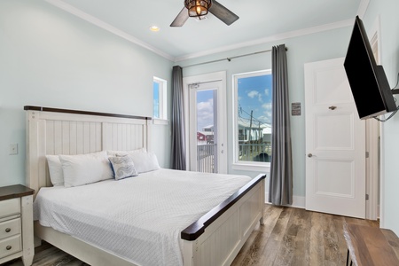 Bedroom 4 offers a King bed, TV, balcony access and private bathroom