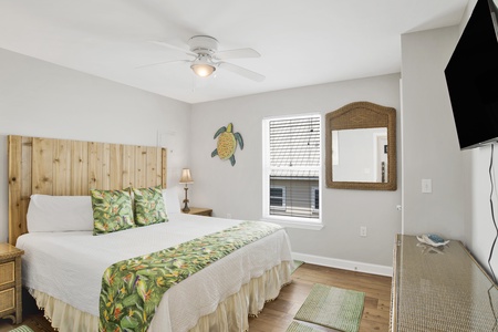 Guest bedroom 2 offers a King bed and TV