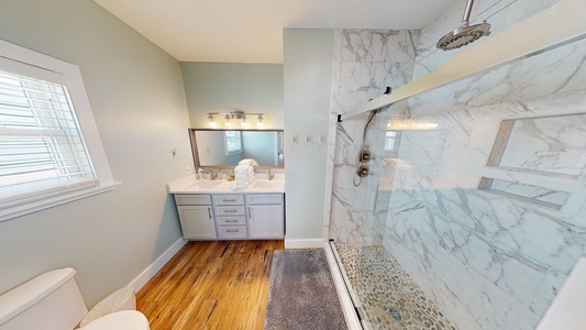 The private Master bath has a double vanity
