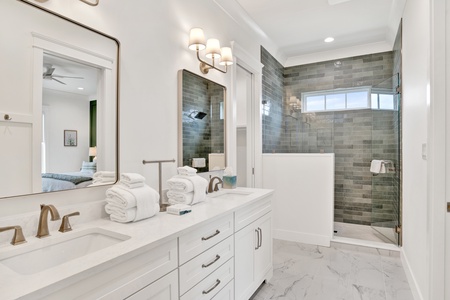 The bathroom has double vanities and walk-in closet
