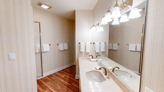 The private bath in Bedroom 4 has a double vanity and a walk-in shower