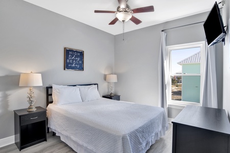 Bedroom 4 is upstairs featuring a queen bed and TV and ceiling fan