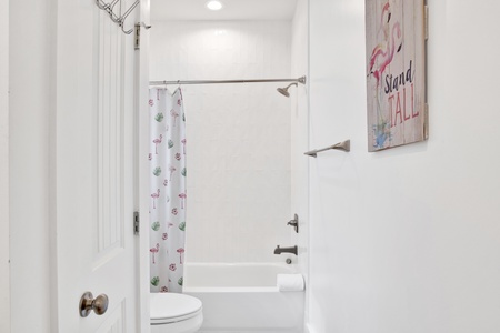 The hallway bathroom features a tub/shower combo