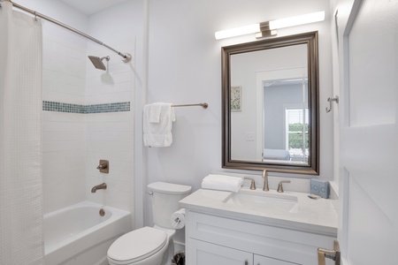 Summertime Blues I-The private bathroom for bedroom 5 has a tub/shower combo