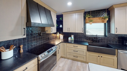 Stainless appliances and a tile backsplash