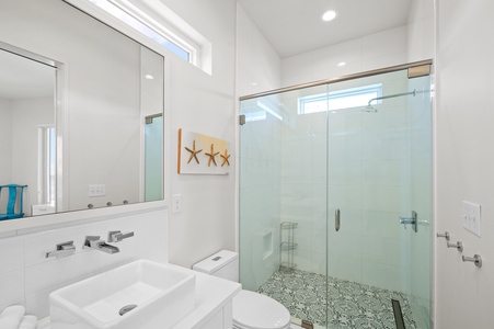 The private bathroom in Bedroom 3 has a large walk-in shower