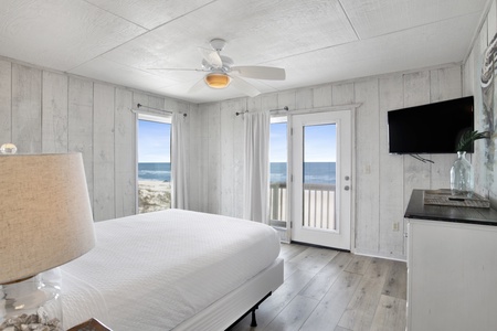 2nd level, master bedroom with a Gulf view, TV, and private balcony