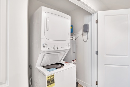 In unit stacked washer and dryer