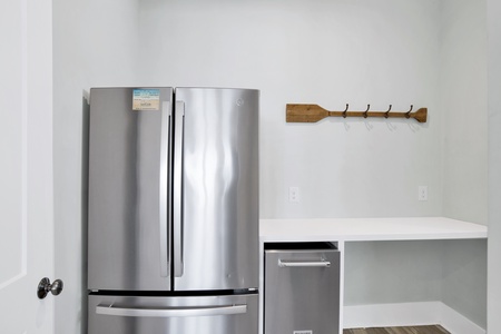 Features a standalone ice maker and full size fridge