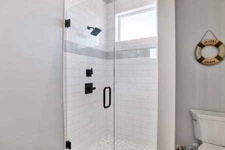 The bathroom in bedroom 2 has a walk-in shower